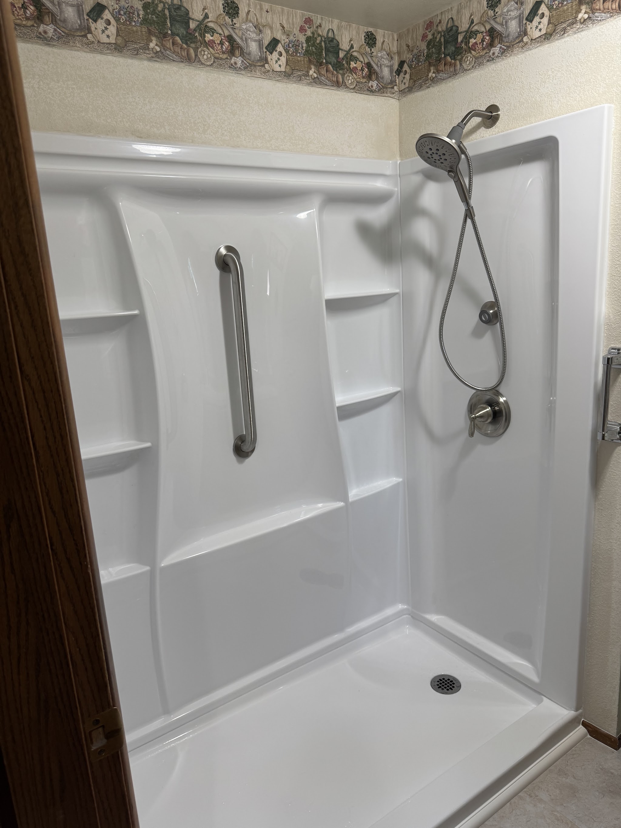 Accessible walk-in shower with grab bars, finished install